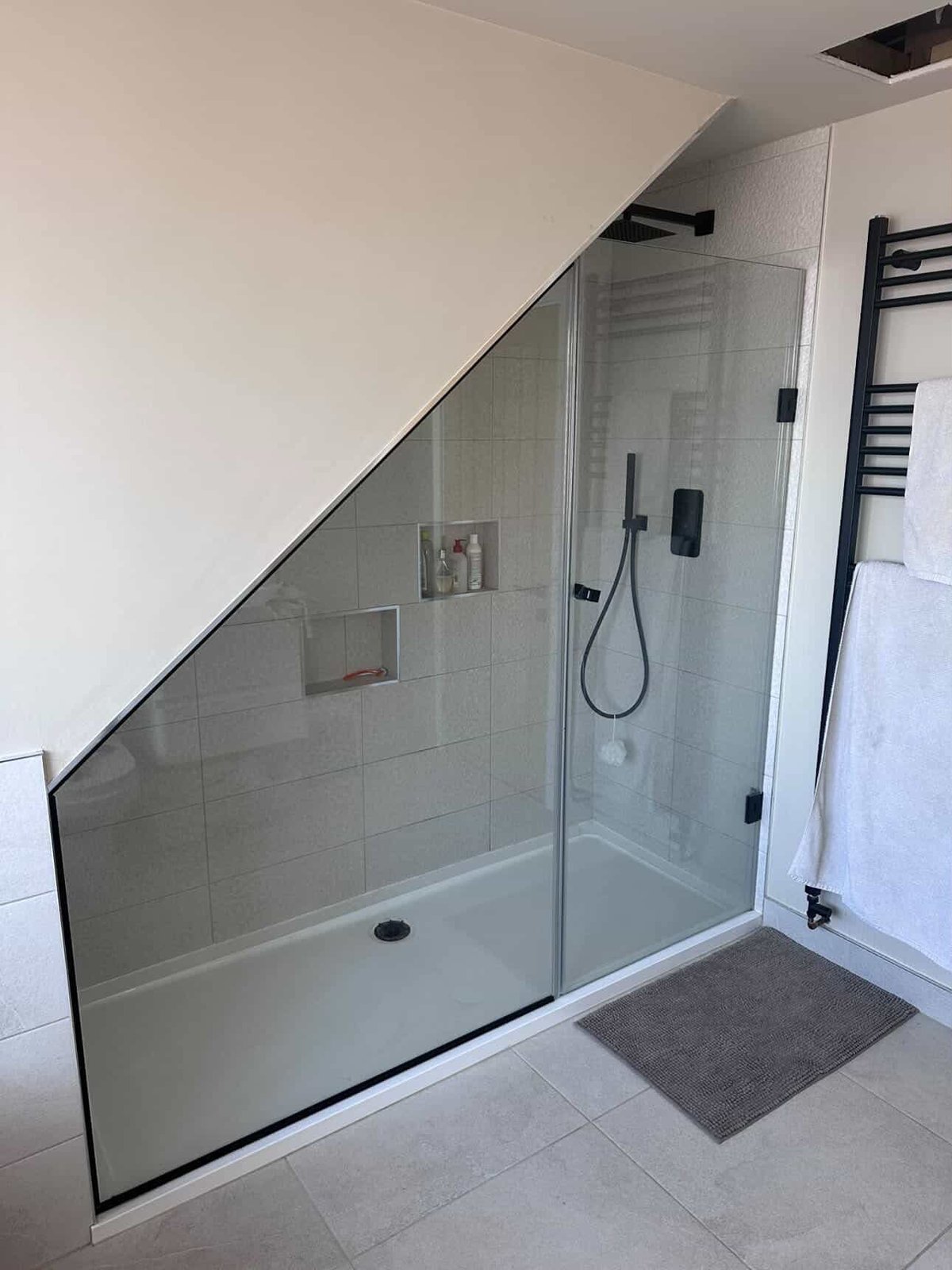 Loft shower room with black brassware